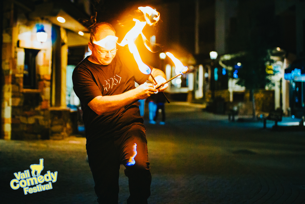 Night time magic activity at the 2022 Vail Comedy Festival included fire effects in the streets of Vail, Colorado