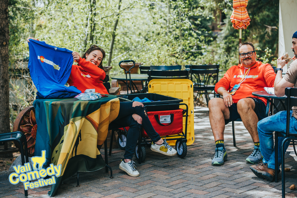 2023 Vail Comedy Festival - Merch here!  Get your merch here!  Festival volunteers hawk hoodies and shirts and other merchandise in Vail Village