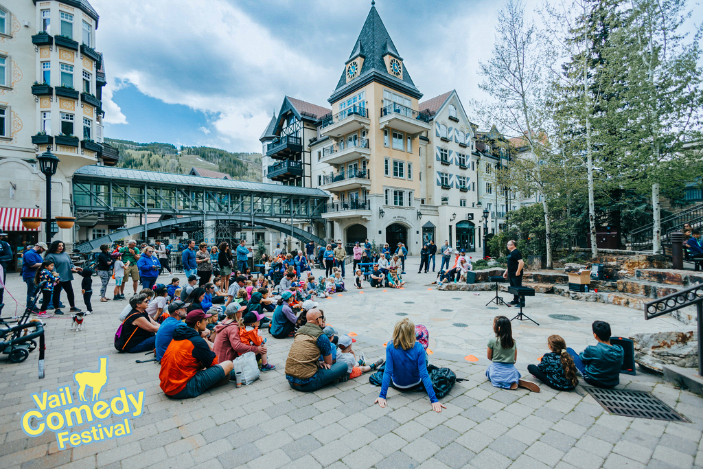 2023 Vail Comedy Festival - A free for the community outdoor magic show draws attention outside Rocketfizz Candy store by the Arrabelle.